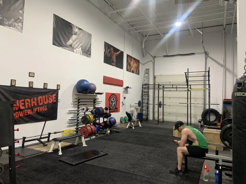 Powerlifting corner with turf and racks at the NE Calgary gym
